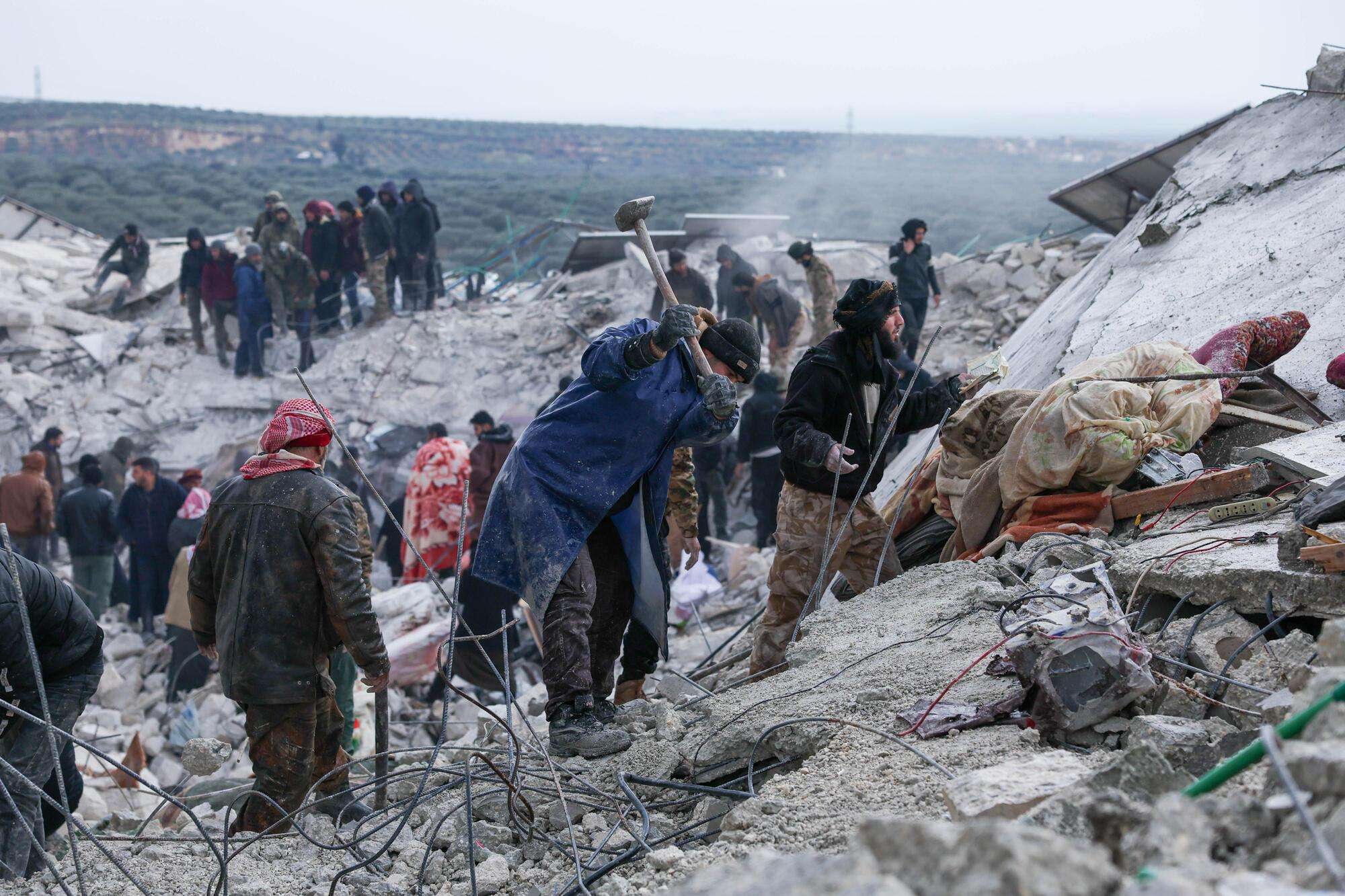 Syrians dig through the rubble left by the earthquake in northwest Syria in 2023.