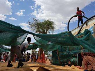 MSF water and sanitation teams deliver clean drinking water from trucks in Aby Aday IDP camp in Tigray, Ethiopia.