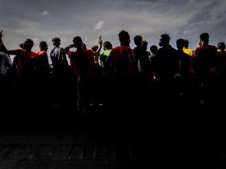 Silhouettes of people rescued by MSF from the Mediterranean Sea
