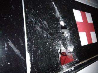 The partially shattered glass window of an MSF ambulance in Selydove.