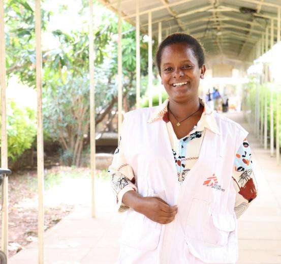 Health promotion officer Teka in front of Abiy Adi Hospital in Ethiopia.